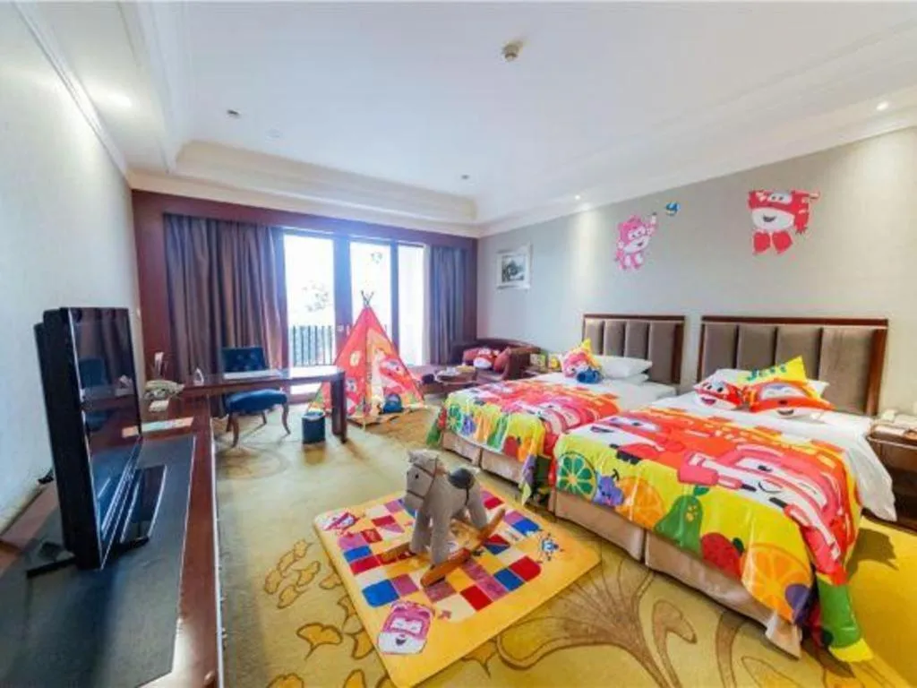 Bed in Xinjin Celebrity City Hotel