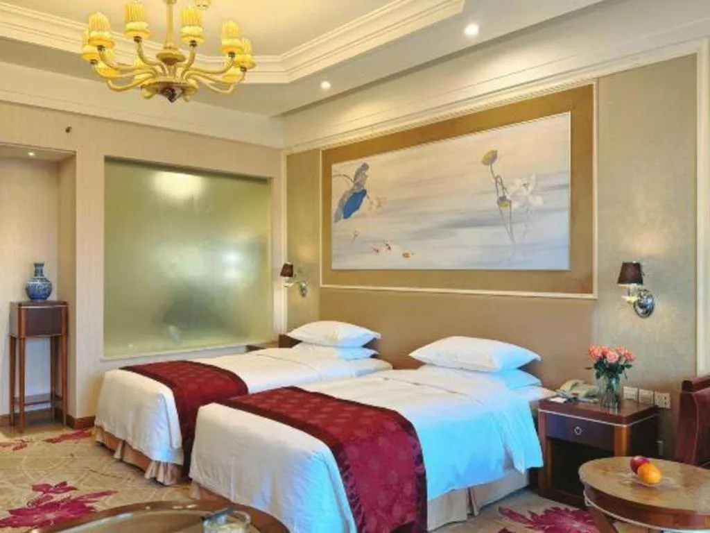 Bed in Xinjin Celebrity City Hotel