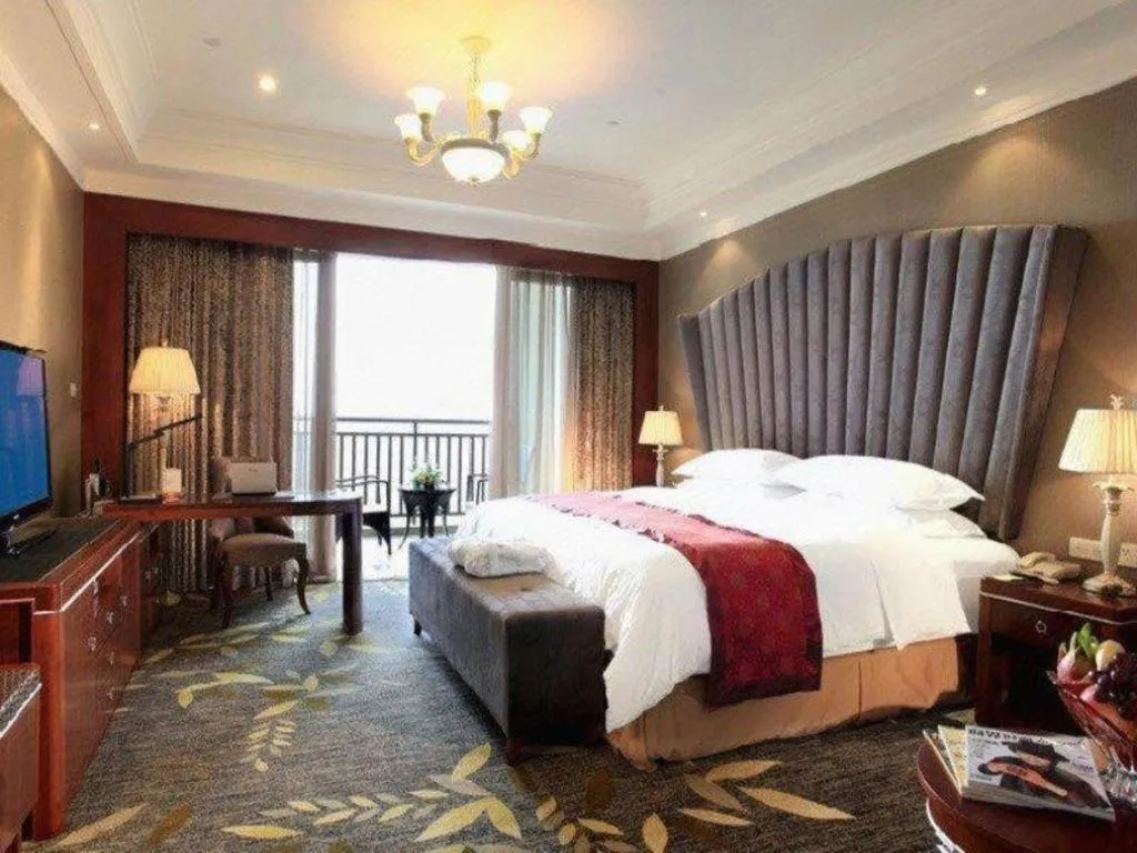 Bed in Xinjin Celebrity City Hotel