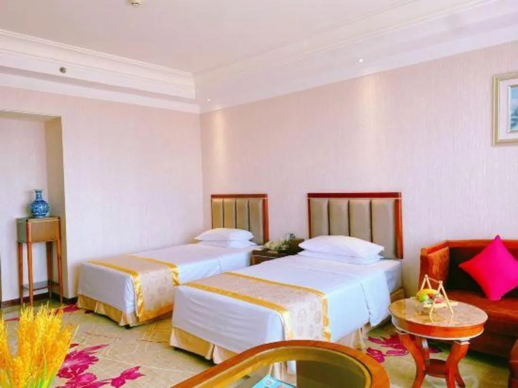 Bed in Xinjin Celebrity City Hotel