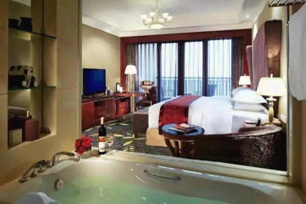 Bed in Xinjin Celebrity City Hotel