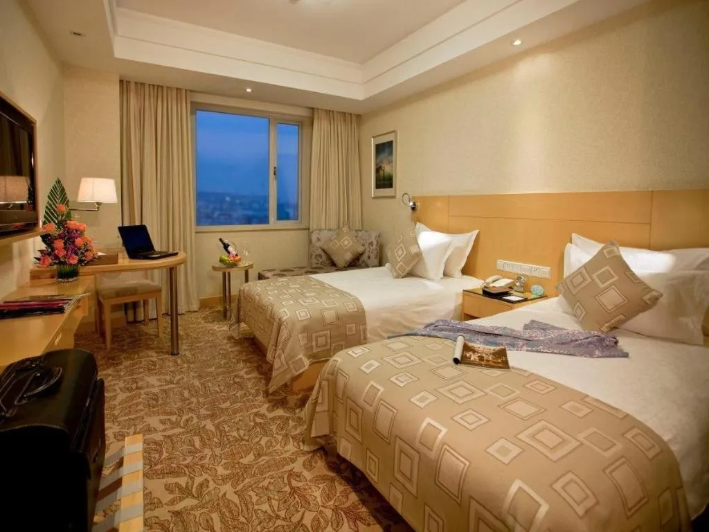 Bed in Huachen Kenzo Hotel Hangzhou