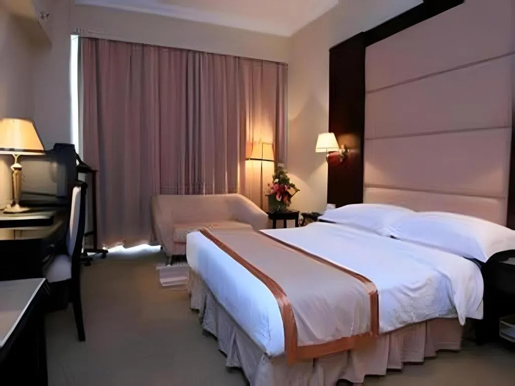 Bed in Economic Trade Hotel