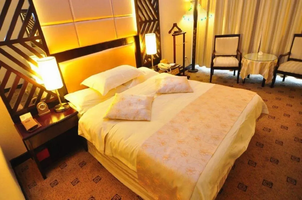 Bed in Economic Trade Hotel