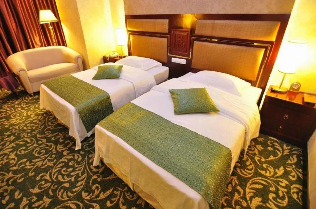 Bed in Economic Trade Hotel