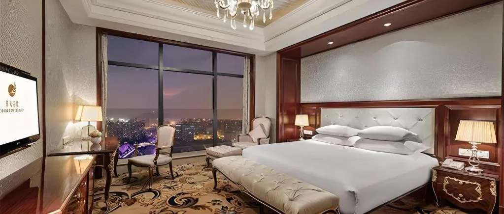 Bed in New Century Grand Hotel Zhejiang Sanli