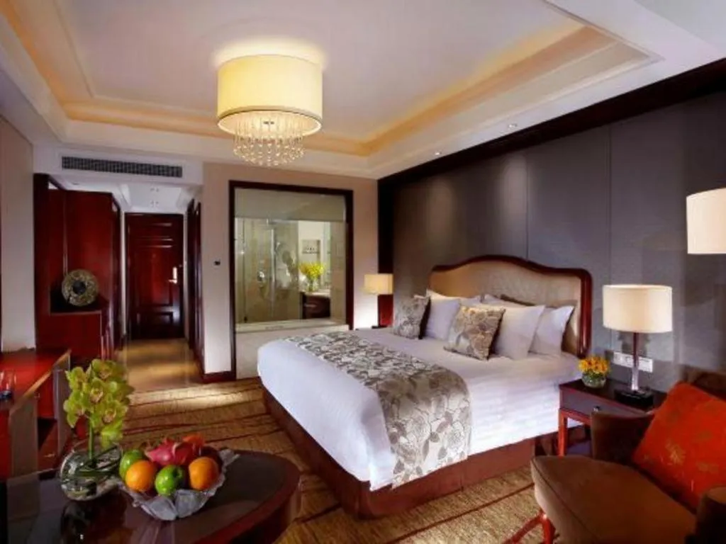 Bed in New Century Grand Hotel Zhejiang Sanli