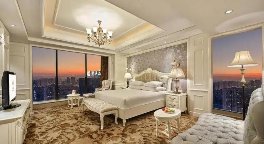 Bed in New Century Grand Hotel Zhejiang Sanli