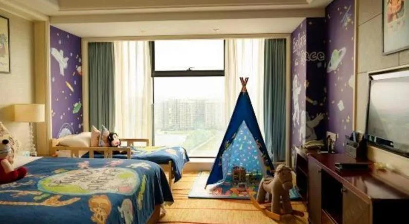 Bed in New Century Grand Hotel Zhejiang Sanli