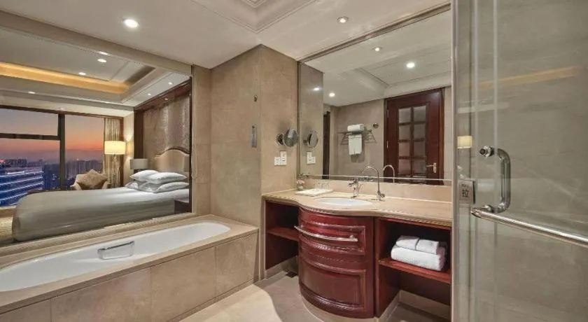 Bed in New Century Grand Hotel Zhejiang Sanli