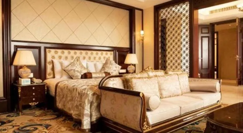 Bed in New Century Grand Hotel Zhejiang Sanli