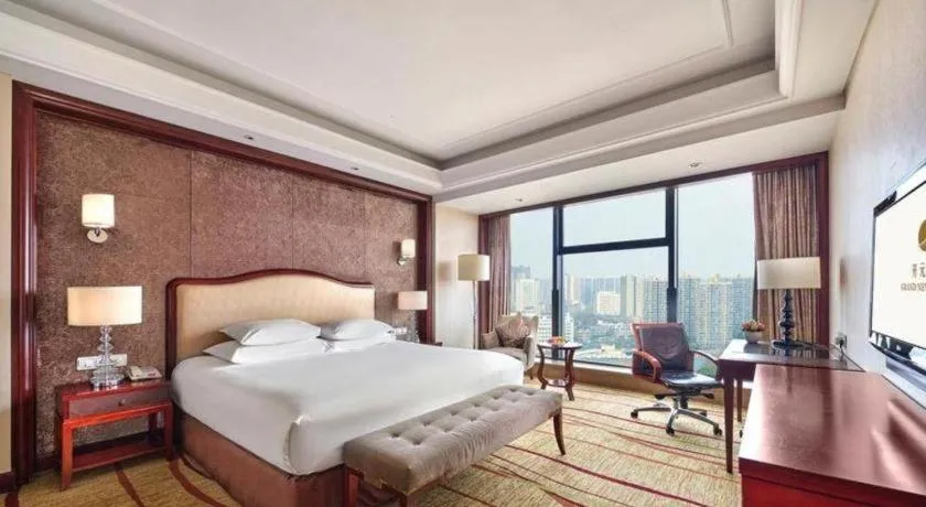 Bed in New Century Grand Hotel Zhejiang Sanli