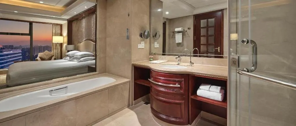 Bed in New Century Grand Hotel Zhejiang Sanli