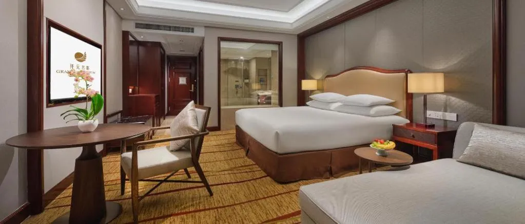 Bed in New Century Grand Hotel Zhejiang Sanli