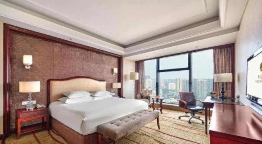 Bed in New Century Grand Hotel Zhejiang Sanli