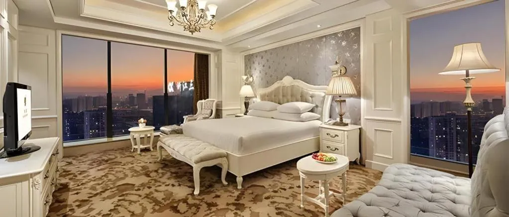 Bed in New Century Grand Hotel Zhejiang Sanli