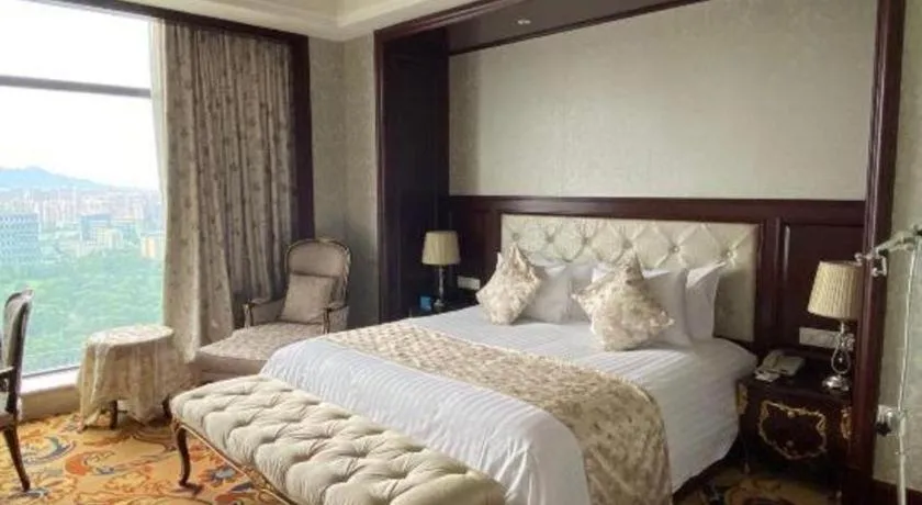 Bed in New Century Grand Hotel Zhejiang Sanli