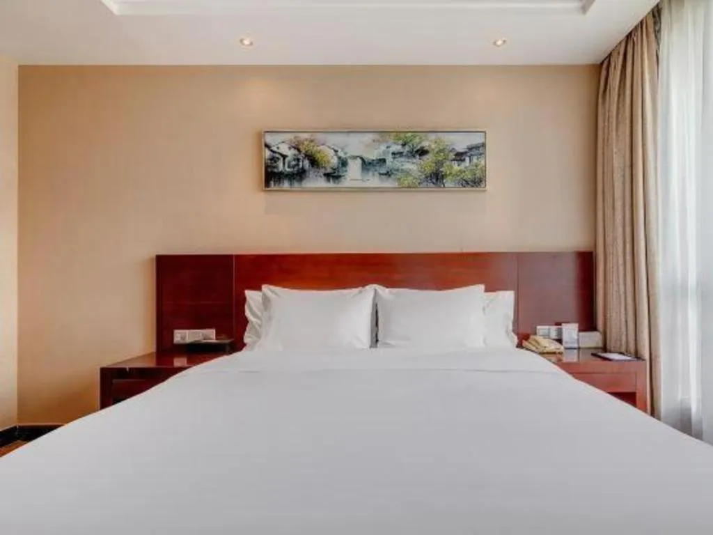 Bed in Jiaxing Fortune Holiday Hotel