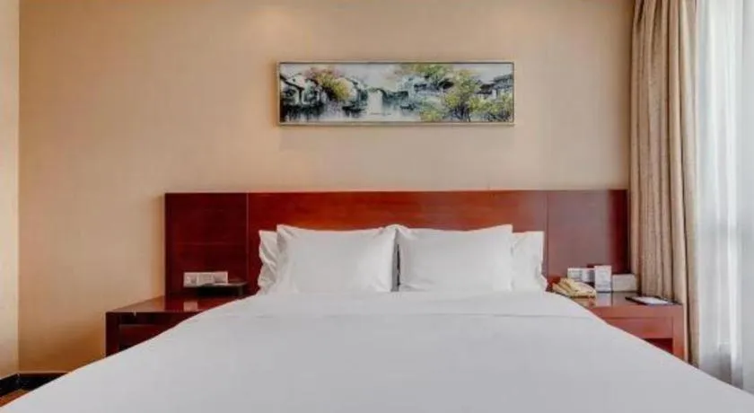 Bed in Jiaxing Fortune Holiday Hotel