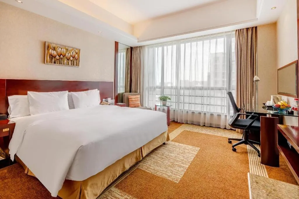 Bed in Jiaxing Fortune Holiday Hotel