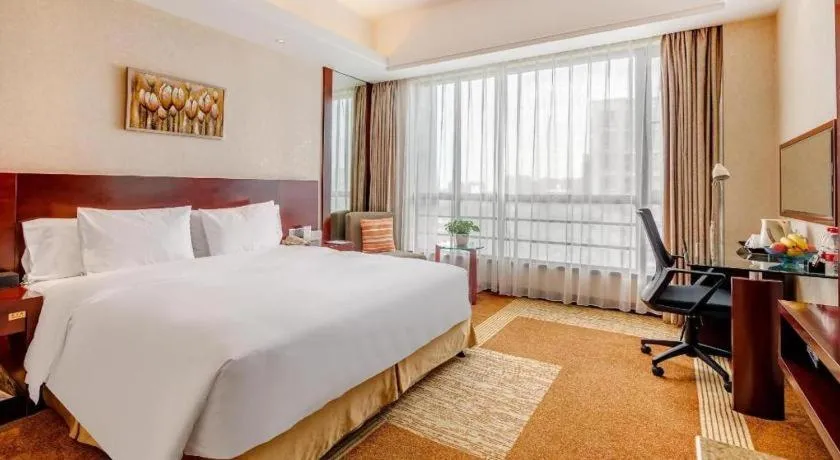 Bed in Jiaxing Fortune Holiday Hotel