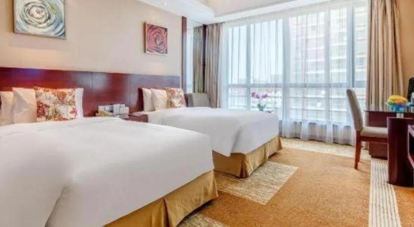 Bed in Jiaxing Fortune Holiday Hotel