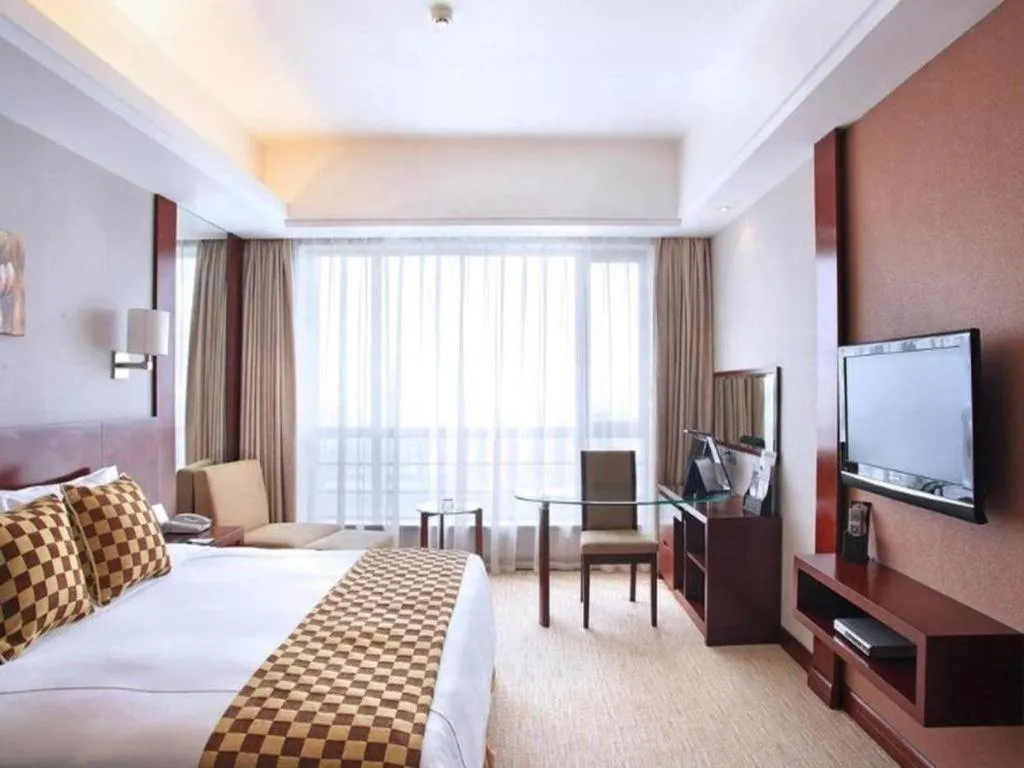 Bed in Jiaxing Fortune Holiday Hotel