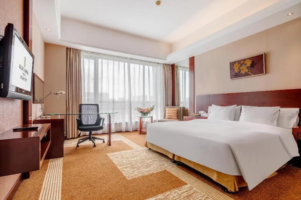 Bed in Jiaxing Fortune Holiday Hotel