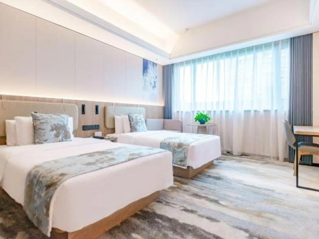 Bed in Jiaxing Fortune Holiday Hotel