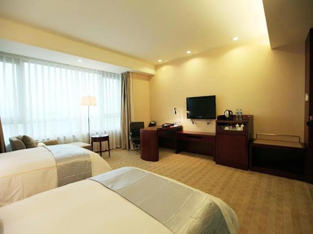 Bed in Chengdu Sovereign Hotel