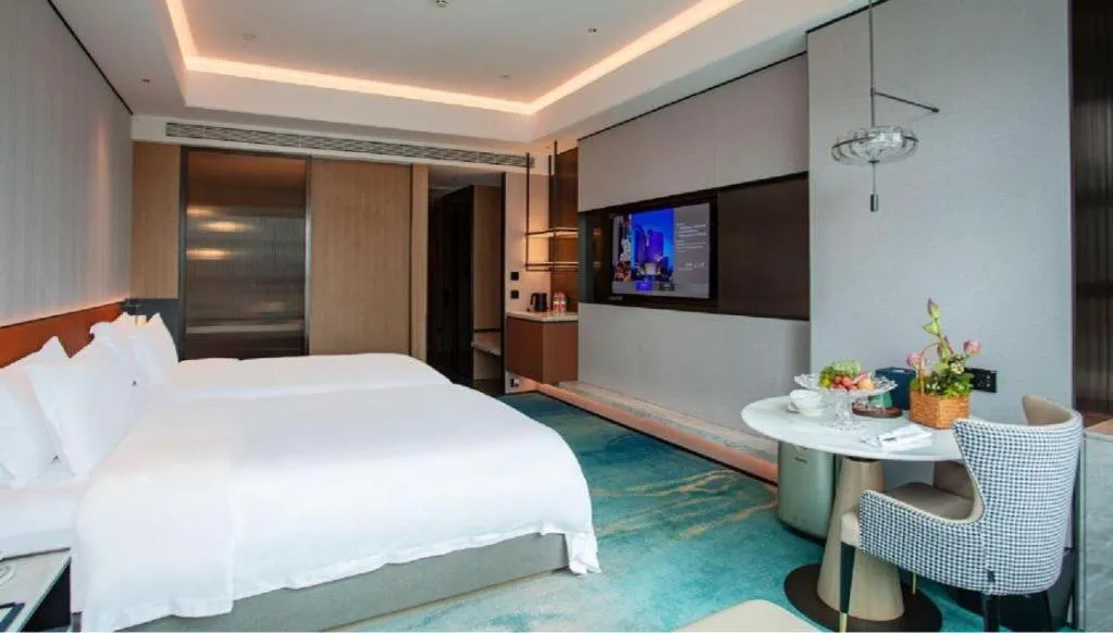 Bed in Fuyang International Trade Centre Hotel