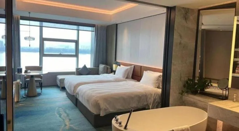 Bed in Fuyang International Trade Centre Hotel