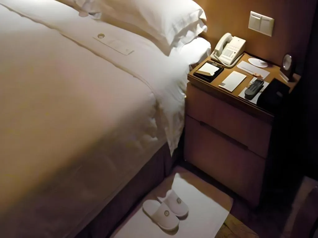 Bed in Fuyang International Trade Centre Hotel