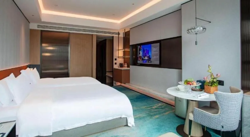 Bed in Fuyang International Trade Centre Hotel