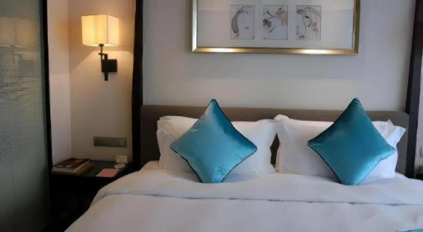 Bed in Fuyang International Trade Centre Hotel