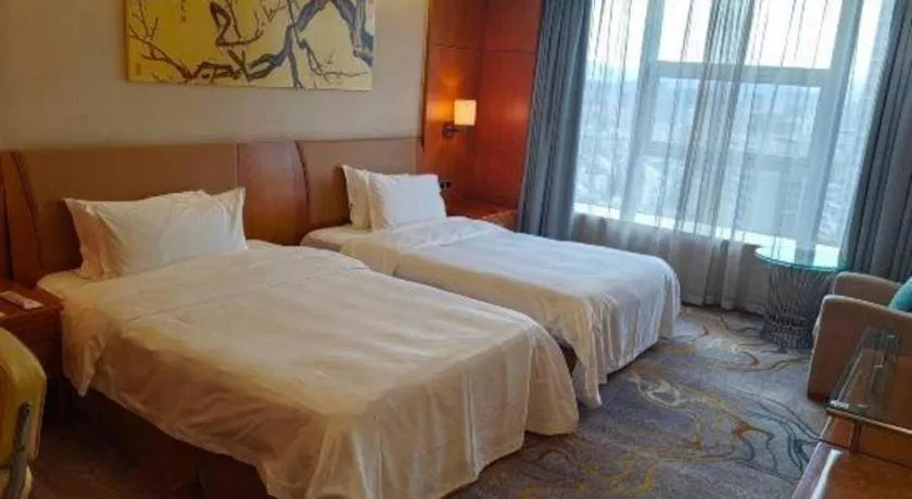 Bed in Fuyang International Trade Centre Hotel