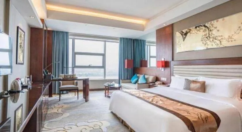 Bed in Fuyang International Trade Centre Hotel