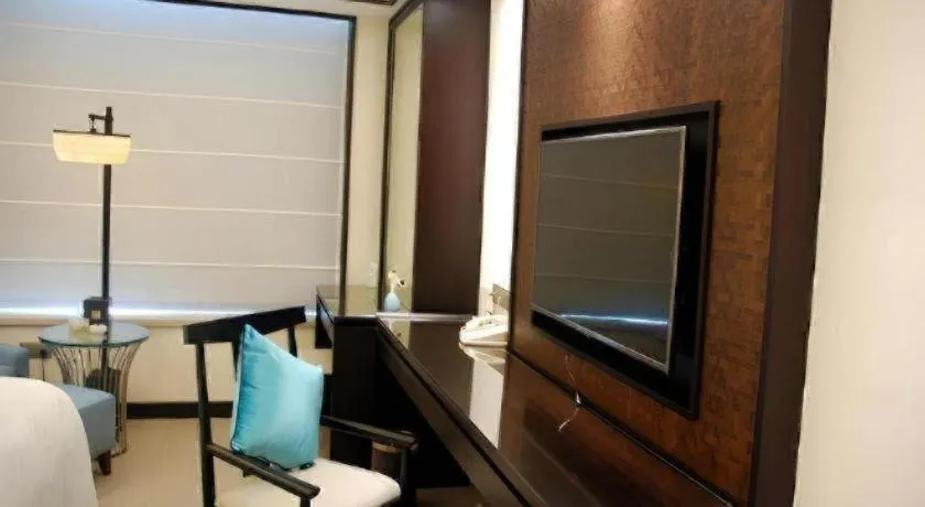 Bed in Fuyang International Trade Centre Hotel