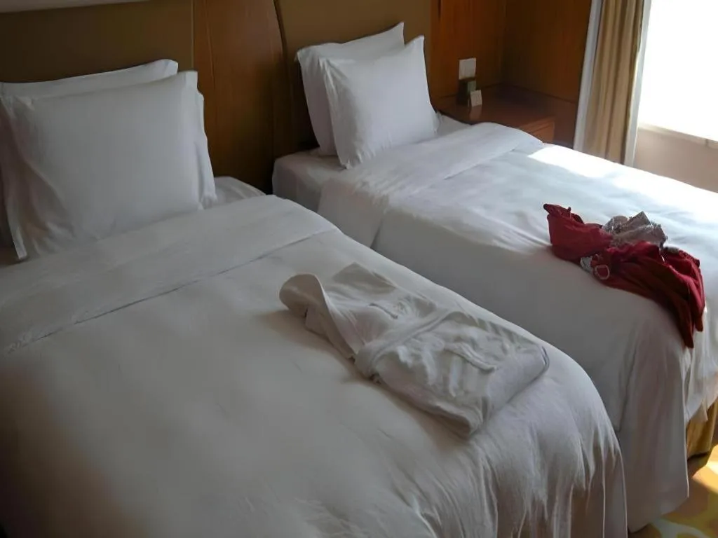 Bed in Fuyang International Trade Centre Hotel
