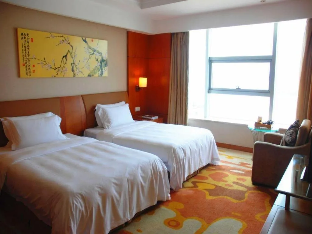Bed in Fuyang International Trade Centre Hotel