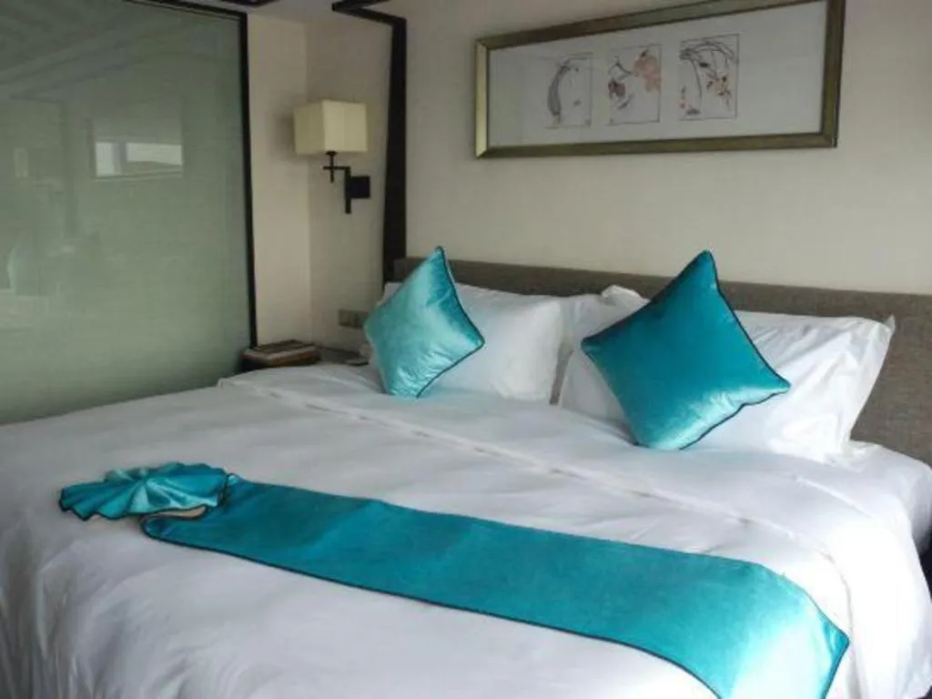 Bed in Fuyang International Trade Centre Hotel