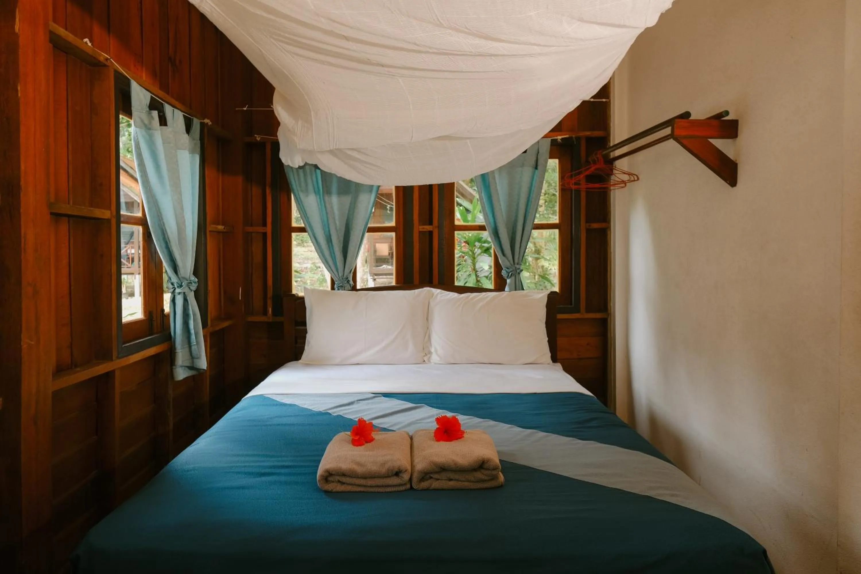 Bed in JOY Bungalow Resort and Restaurant