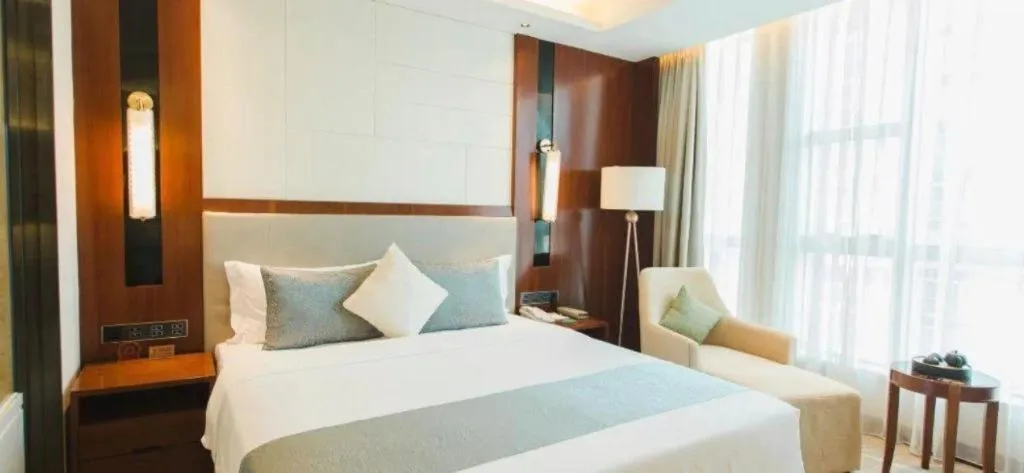 Bed in Grand Soluxe Zhongyou Hotel Shenzhen