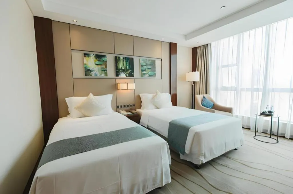 Bed in Grand Soluxe Zhongyou Hotel Shenzhen