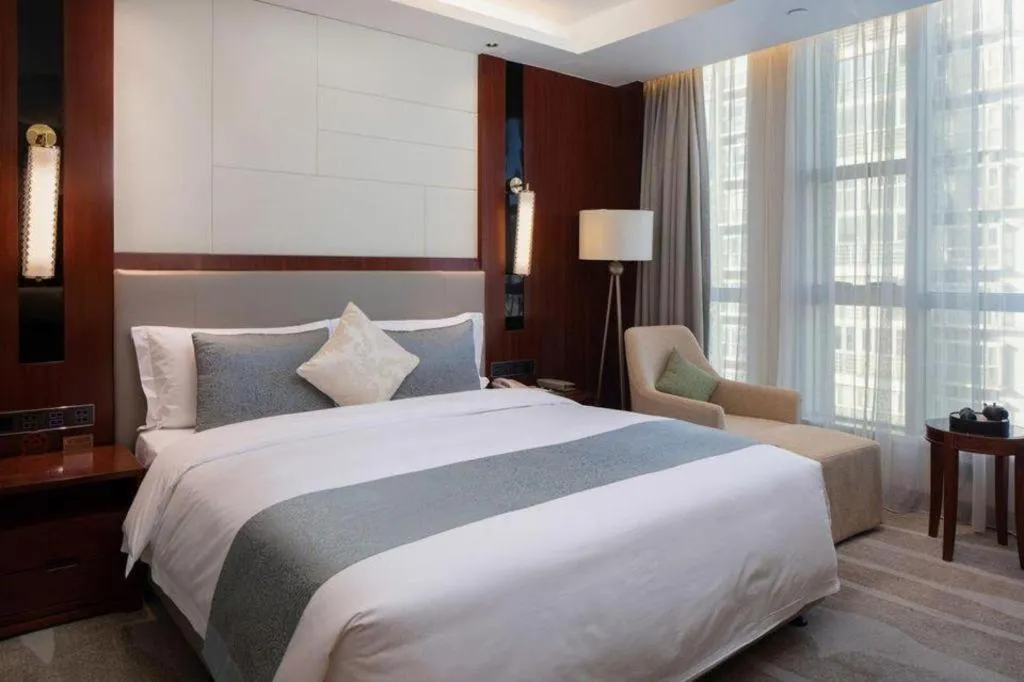 Bed in Grand Soluxe Zhongyou Hotel Shenzhen
