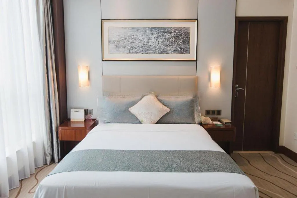 Bed in Grand Soluxe Zhongyou Hotel Shenzhen