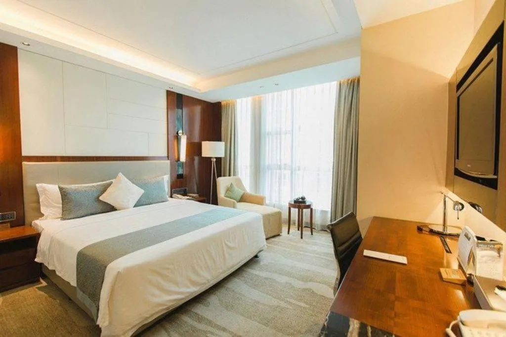 Bed in Grand Soluxe Zhongyou Hotel Shenzhen