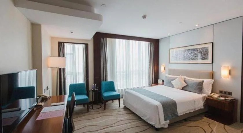 Bed in Grand Soluxe Zhongyou Hotel Shenzhen