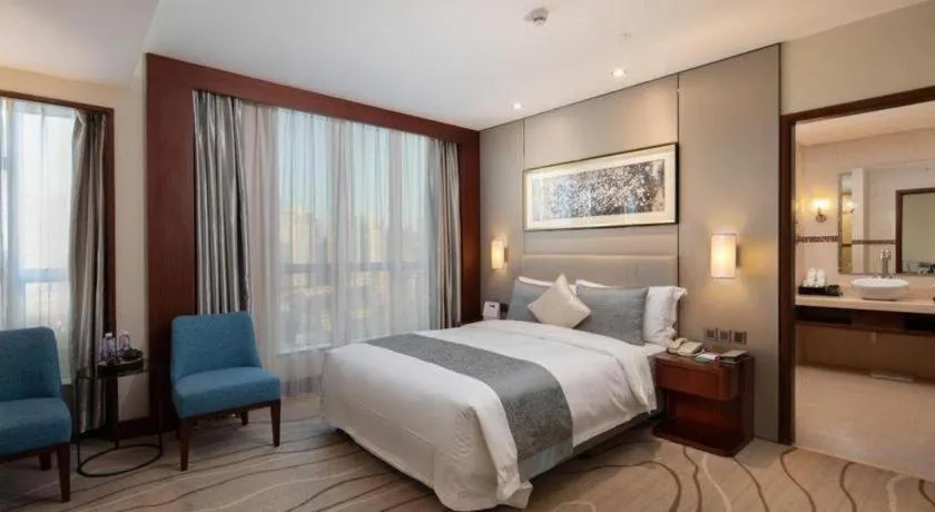 Bed in Grand Soluxe Zhongyou Hotel Shenzhen