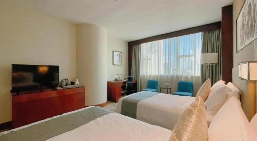 Bed in Grand Soluxe Zhongyou Hotel Shenzhen